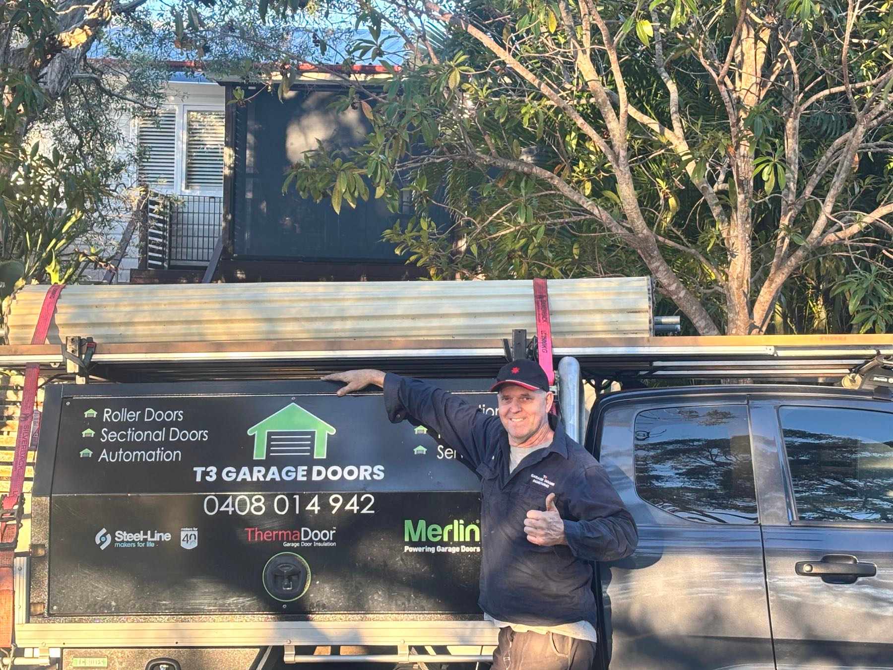 T3 Garage Doors owner-operator beside his service vehicle in Brisbane