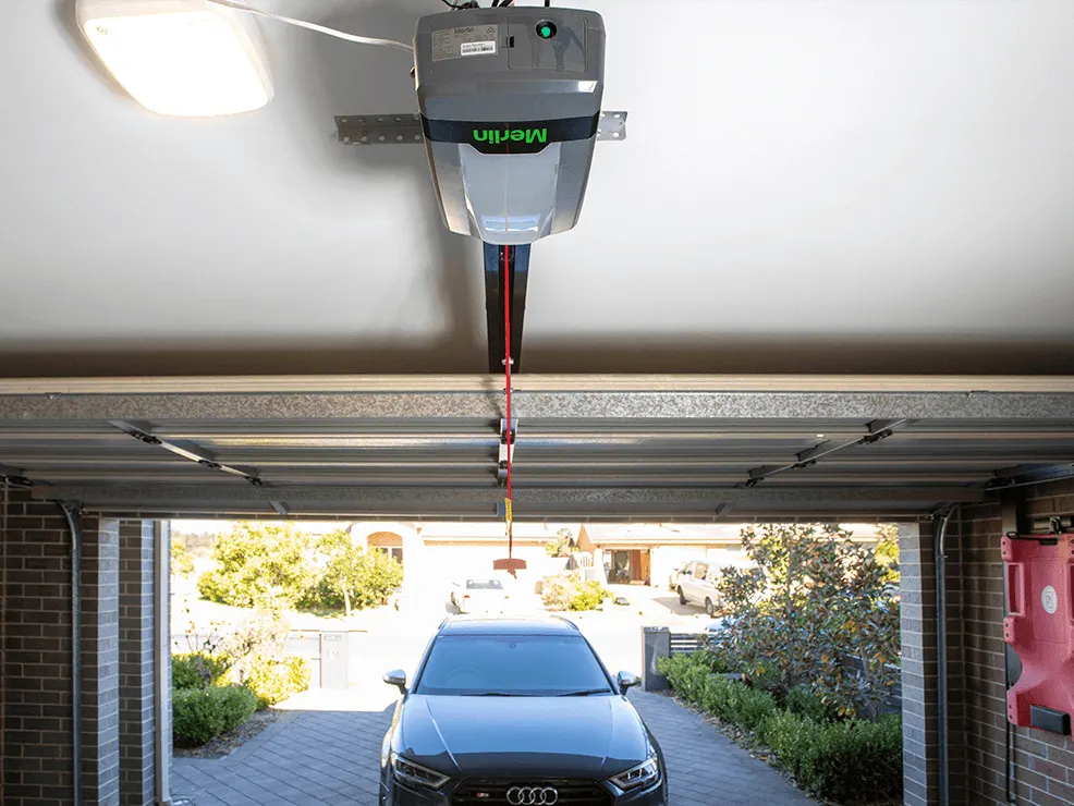 Merlin garage door opener and rail assembly mounted to a garage ceiling